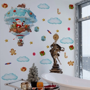 Detail of Christmas wall stickers featuring Santa in a gift balloon on white bathroom walls
