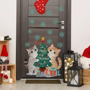 Christmas wall decal featuring cute cats hugging a tree on a dark grey wooden door