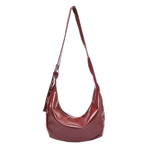 Retro burgundy half-moon crossbody bag in shiny faux leather with adjustable strap