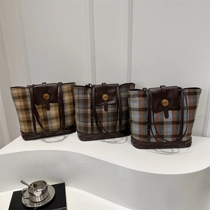 Three plaid wool tote bags in various colors with leather handles and retro N-buckle detail