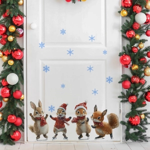 Detail of cute Christmas animal wall stickers with squirrels skating on white door
