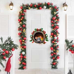 Detail of a cute cartoon mouse door sticker with festive red bow for Christmas decor