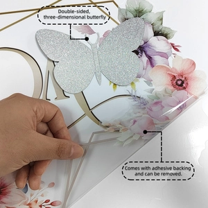 Detail of 3D silver glitter butterfly and self-adhesive floral wall sticker application