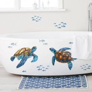 Ocean theme wall stickers featuring colorful sea turtles and blue fish in a bathroom setting