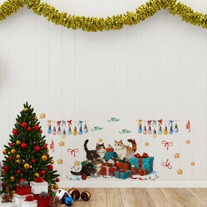 Detailed view of watercolor Christmas wall stickers with cats, lights, and gift boxes