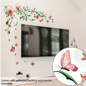 Détail des stickers muraux floraux montrant l'impression papillon et l'adhésif amovible