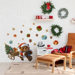 Christmas bear with sleigh wall sticker on white brick wall in festive living room