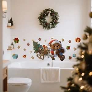 Detail of Christmas wall stickers featuring bears and sleigh on white bathroom tiles