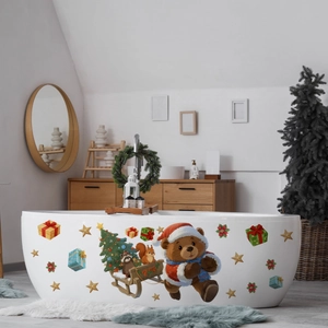 Detail of cute Christmas bear and gift stickers applied on white bathtub surface
