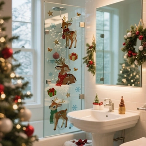 Detail of Christmas reindeer wall decals with snowflakes and gift box on glass door