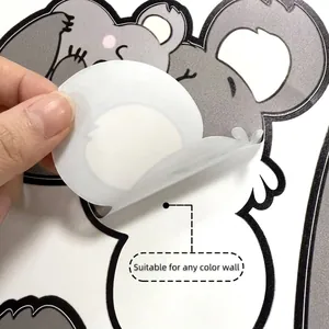 Detail of koala wall sticker peeling off to show suitability for any color wall surface
