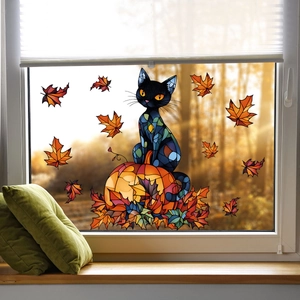 Detail of static window cling featuring a black cat on a pumpkin with maple leaves