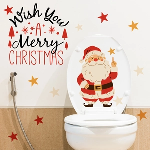 Detail of Christmas wall stickers with Santa and stars on a white tile bathroom wall