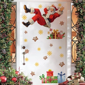 Macro detail of Christmas Santa wall stickers on a door with festive pine decor