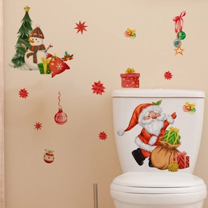 Detailed view of creative Christmas wall decals with Santa and tree motifs on a wall