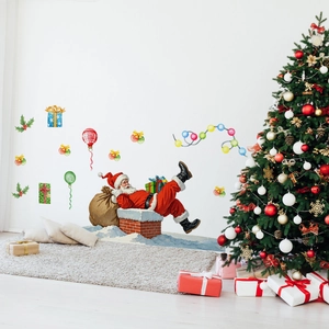 Detailed Christmas wall decals with Santa, gifts and balloons on a white living room wall