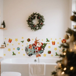 Detail of Christmas wall stickers showing Santa in a blue car on white bathroom tiles