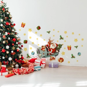Christmas wall decal set with Santa in a car and reindeer on a white interior wall