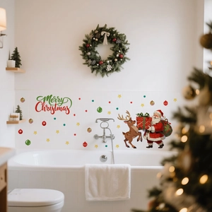Detail of Santa Claus and Reindeer wall stickers on white bathroom tiles with Christmas decor