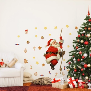 Detail of Christmas Santa wall stickers with stars and candy canes on a white wall