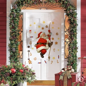 Climbing Santa Claus wall sticker set with stars and candy on a white door