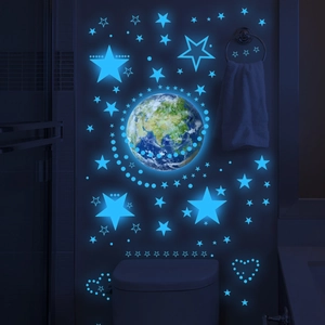 Stickers muraux lumineux avec terre et étoiles bleues pour décoration de chambre nuit