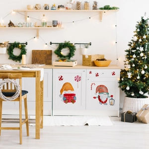 Christmas gnome wall stickers with candy canes and gift boxes on a cozy kitchen wall