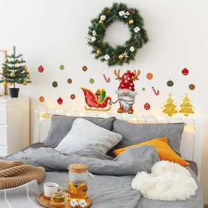 Bedroom wall scene featuring festive Christmas gnome decals with sled and tree ornaments