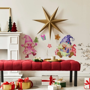 Detailed view of colorful Christmas gnome wall decals on a white wall with festive decor