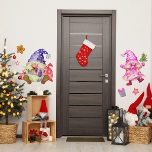 Detailed view of hand-painted Christmas gnomes and gingerbread man wall stickers on door