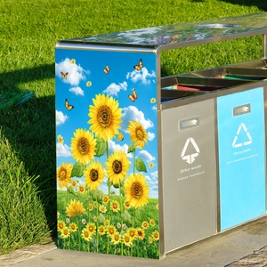 Outdoor metal waste bin featuring sunflower butterfly decals on green lawn