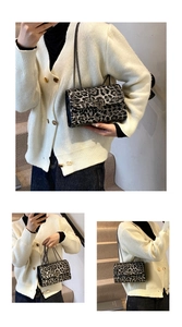Close-up of leopard print shoulder bag with metal chain strap and rivet details