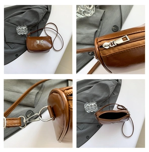 Détails du sac bandoulière marron brillant avec boucle nœud argenté et fermeture éclair