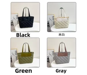 Detailed view of four quilted tote bags in black, beige, green, and gray colors