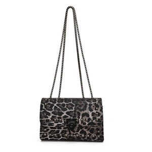 Chic leopard print crossbody bag with rockstud rivets and metal chain straps