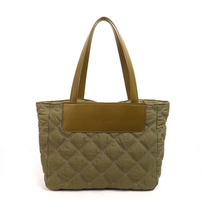 Quilted olive green tote bag with leather handles and diamond pattern for daily commuting