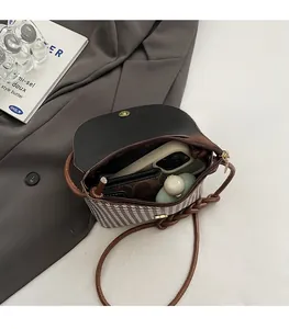 Internal view of houndstooth bucket bag showing space for phone and essentials