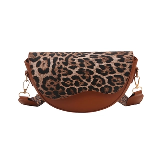 Retro saddle shoulder bag with leopard print flap and brown faux leather details