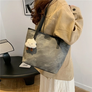 Minimalist large smoke gray tote bag with a cloud charm and fashion logo patch