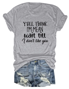 Detail of gray slogan t-shirt paired with distressed light blue denim shorts
