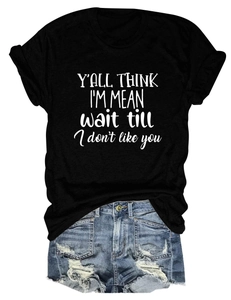 Flat lay of cotton t-shirt with Y'ALL THINK I'M MEAN print and denim shorts