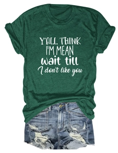 Deep green crew neck T-shirt with white graphic slogan paired with distressed denim shorts