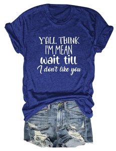 Detail of navy blue crew neck T-shirt with white slogan print and ripped denim shorts
