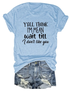 Detailed flat lay of light blue T-shirt with black text and ripped denim shorts