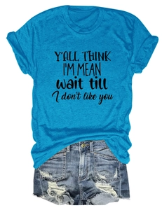 Flat lay of peacock blue T-shirt with graphic print and distressed denim shorts