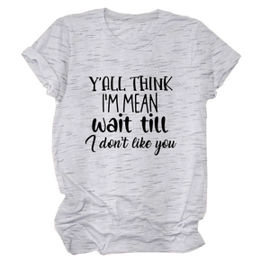 Detail view of heather gray cotton T-shirt with rolled sleeves and a black slogan print