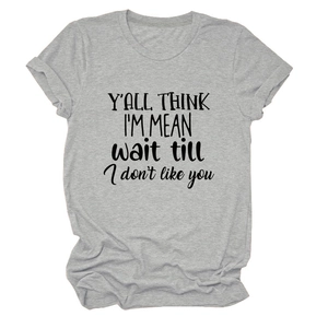Detail of grey crewneck T-shirt featuring rolled sleeves and black typography print