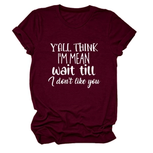 Detail view of burgundy round neck T-shirt with white graphic text print and rolled sleeves