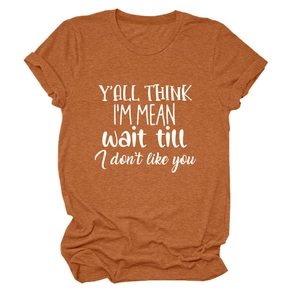 Detail of rust orange crew neck T-shirt with white graphic print and cuffed sleeves