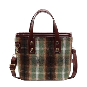 Retro wool plaid bucket bag with brown leather straps and gold stud details